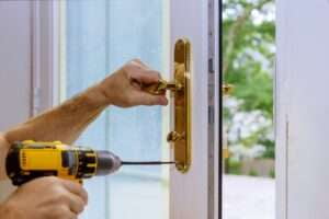 Locksmith installing new lock or repair the door lock