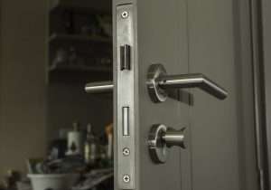 Door lock and silver handle. Services offered by residential locksmiths.