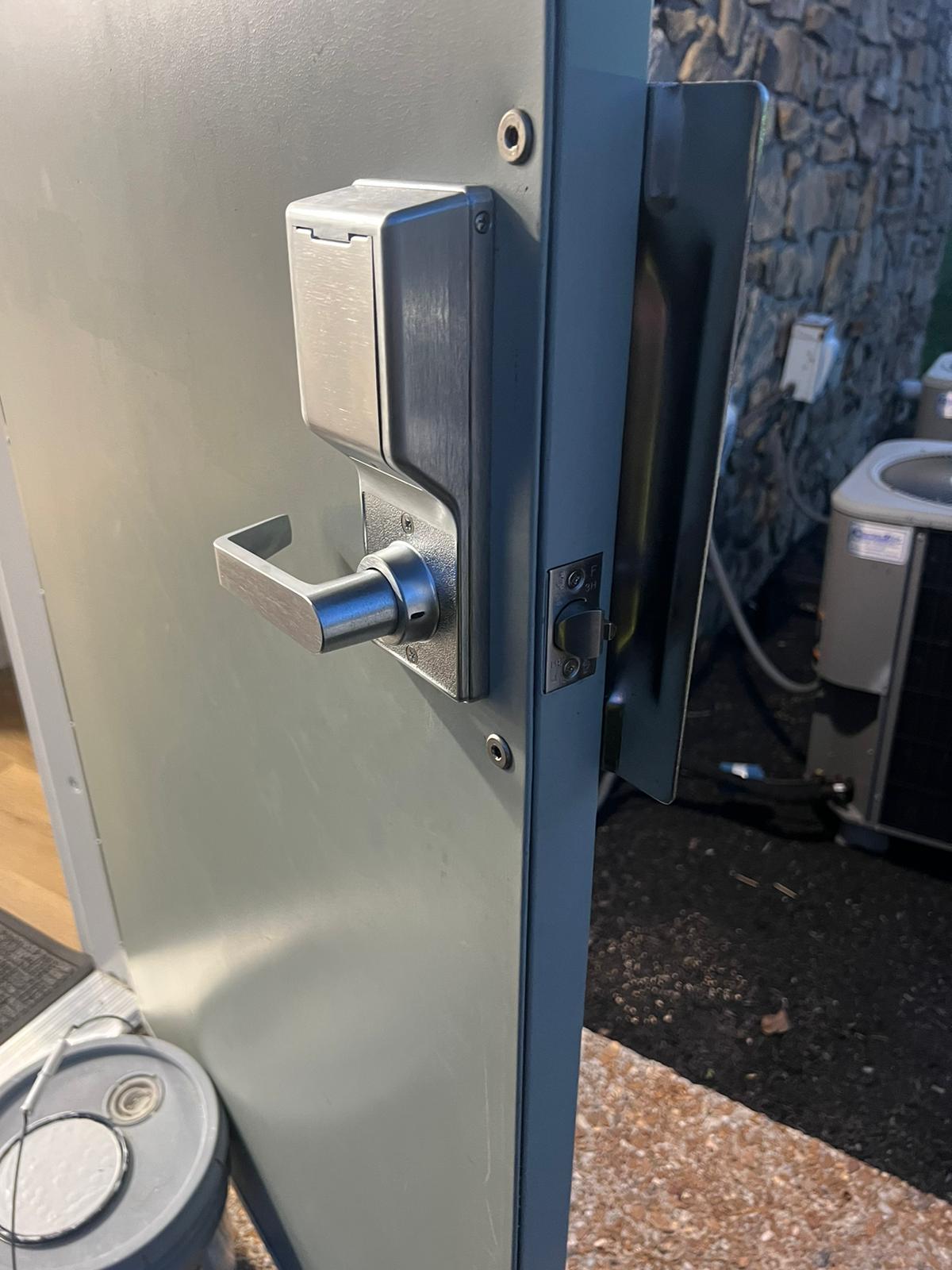 Commercial Install Hardware New keypad entry lockset installed on a business door