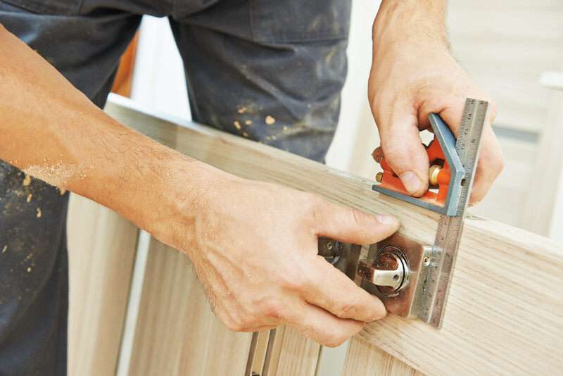 Professional lock installation into wood door