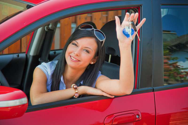 Woman with new car keys